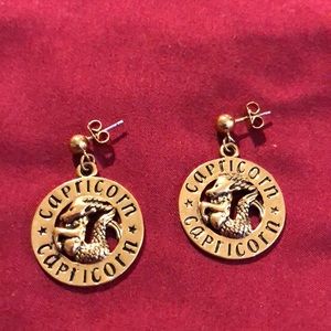 Gold plated  round dangling Capricorn earrings